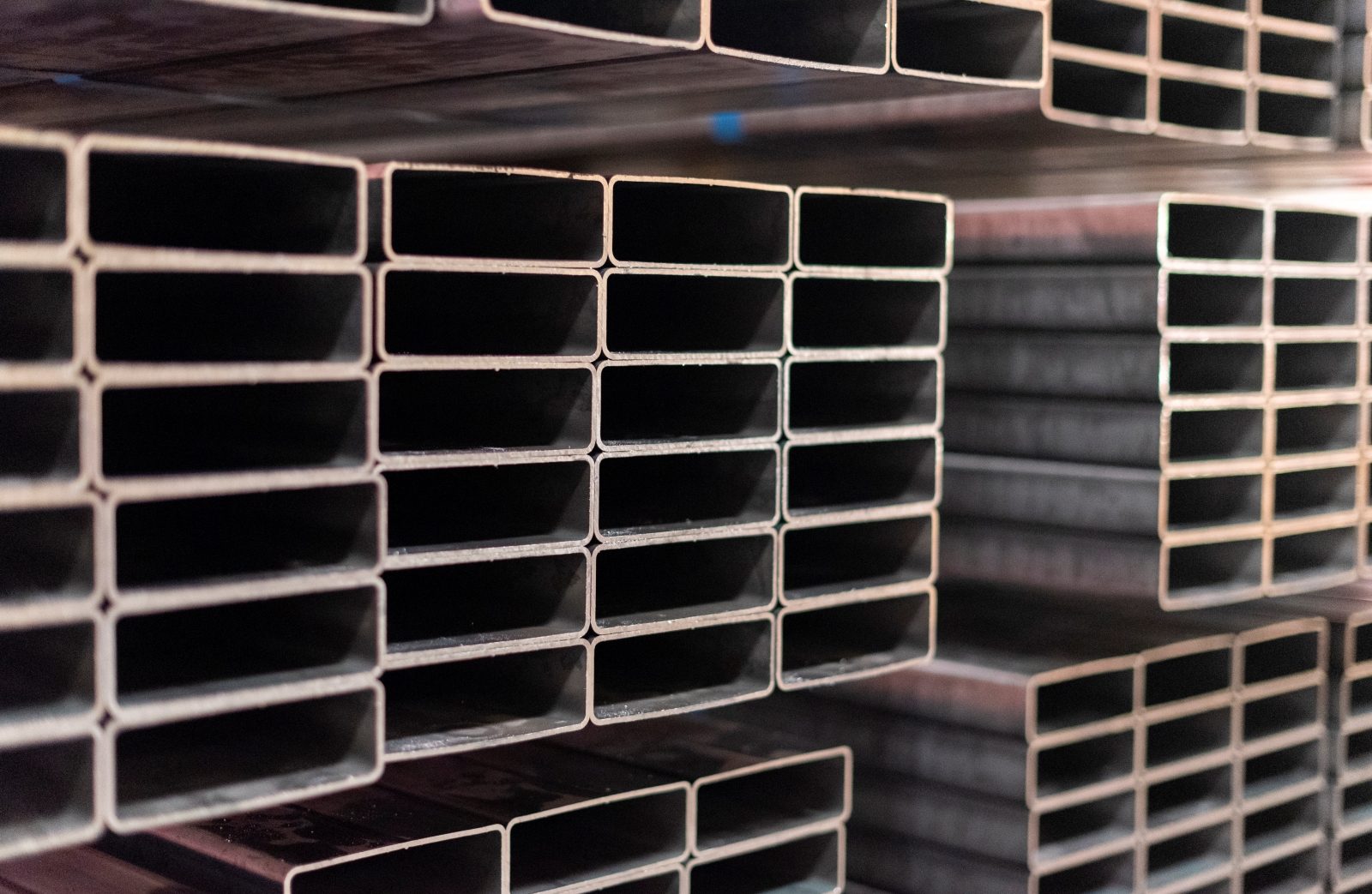 Steel Tubing Products in Storage Stacked rectangular steel tubes showcasing the precision and quality of Heidtman Steel’s tubing process.