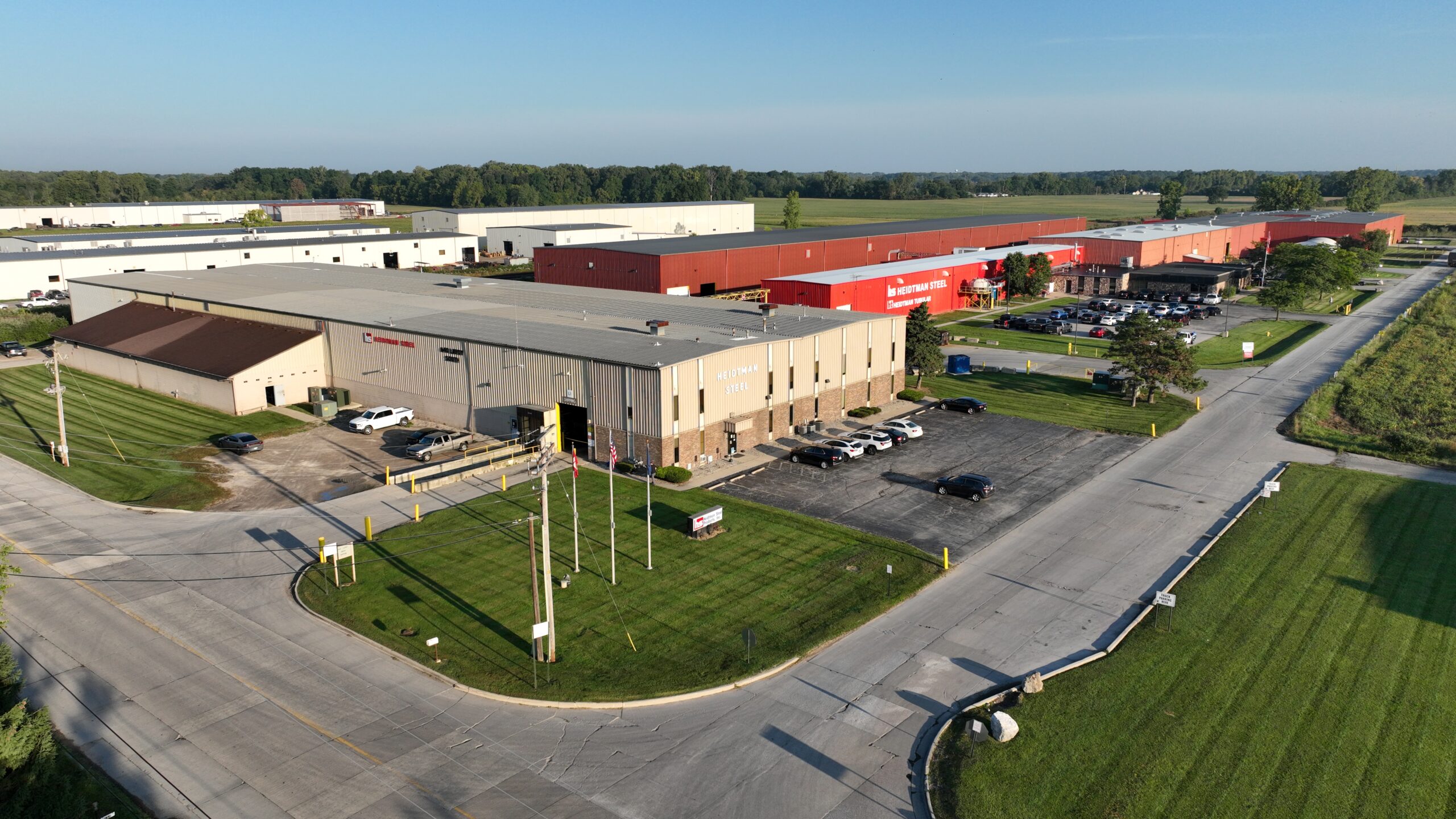 Heidtman Steel Erie MI Campus Drone View Drone shot of Heidtman Steel Erie MI campus with buildings and parking lot.