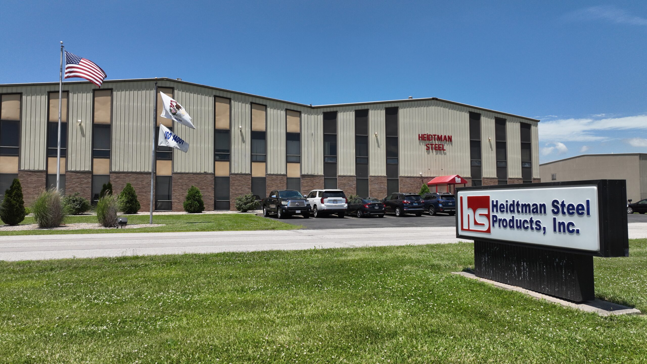 Heidtman Steel Granite City Facility Exterior Exterior of Heidtman Steel Granite City facility with sign and flags.